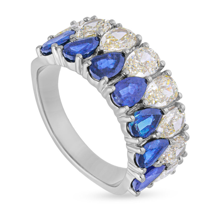 "Timeless Pear-Shaped Blue and White Diamond Ring in Classic Setting"